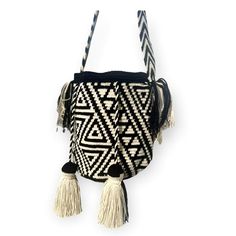 You will never go wrong with Black and Off-white!!! Unique and Stylish crochet bag! Very lightweight, durable and comfortable to carry on. Wear it as a crossbody or shoulder bag. These stunning boho style bags are perfect for a casual day, as a beach/pool accessory or as a complement to your sports outfit. Details: Bucket bag style Special Edition design with colorful and traditional patterns Double-thread & one needle crocheted Matching handmade single-thread strap Drawstring closure with Speci White Woven Hobo Bag For Travel, White Crossbody Beach Bag With Adjustable Strap, White Bohemian Bucket Bag For Everyday, White Crossbody Beach Bag For Travel, Everyday White Bohemian Bucket Bag, Handwoven Black Bucket Bag For Vacation, Black Handwoven Bucket Bag For Vacation, White Bohemian Hobo Bag For Travel, White Woven Shoulder Bucket Bag