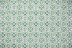 an old wallpaper with green and pink flowers on it