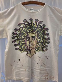 Alice Cooper 1997 Rock & Roll Carnival Local Crew XL T-Shirt paint splatter across bottom of shirt Relaxed Fit Paint Splatter T-shirt With Crew Neck, Casual Paint Splatter T-shirt For Streetwear, Casual T-shirt With Paint Splatter For Streetwear, Graphic Tee With Paint Splatter And Crew Neck, Paint Splatter Graphic Tee With Crew Neck, Graphic Tee With Paint Splatter For Streetwear, Streetwear Paint Splatter Graphic Tee, Summer Streetwear Tops With Paint Splatter, Streetwear Cotton Tops With Paint Splatter