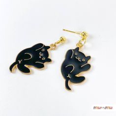 Show off your love for cats with these adorable black cat earrings! Featuring a playful black cat design, these earrings are perfect for cat lovers and pet owners who want a fun and unique accessory. Choose from stud, hook, or clip-on closures to ensure a comfortable fit for any occasion. These kawaii-inspired earrings make a charming gift for any cat lover, adding a touch of feline fun to their wardrobe. Add these cute black cat earrings to your collection today and let your love for cats shine Black Cat Earrings, Fun Jewelry, Cute Black Cats, Earrings Cute, Cat Lover Gift, Cat Earrings, Enamel Charms, Stunning Earrings, Charm Gift