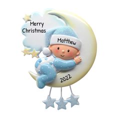 a christmas ornament with a baby on the moon