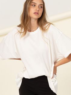 Have a more leisurely day in this Just Chilling Oversized T-Shirt. A casual tee that shapes a crew neckline with drop shoulders and short sleeves over a wide-cut bodice that extends into an oversized silhouette with a simple hem. Choose your favorite color and pair it with cute shorts and or your favorite denim or knot it over a midi skirt. Colors: Whipped Cream, Black, Jam, Brown Sugar, Hunter Green, Blush, or Dusty Blue Fabric: 100% Cotton Includes: x1 Shirt Sizes: S/M or M/L Oversized Short Sleeve T-shirt For Everyday, Basic Oversized Crew Neck T-shirt, Oversized Cropped Crew Neck T-shirt For Everyday, Trendy Batwing Sleeve T-shirt For Summer, Trendy Oversized Cropped T-shirt For Summer, Relaxed Drop Shoulder Everyday T-shirt, Spring Graphic Tee With Drop Shoulder, Oversized Trendy Cropped T-shirt With Short Sleeves, Trendy Oversized T-shirt For Everyday