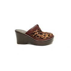 Vintage 1990s brown leather leopard print pony hair platform wedge mule clogs by Born. Features leopard print dyed pony hair uppers, brown leather trim, rounded toe, slip on mule style, thick platform, and chunky wedge heel. Excellent vintage condition.   Heel to toe (inside shoe): 9.375 inches  Ball of foot (bottom of sole): 3.5 inches  Heel height: 3.25 inches  Size 7