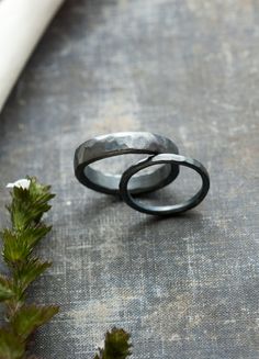 two black rings sitting on top of a table