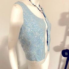 New! Gorgeous! Shimmery Light Blue Sequins & Beaded Sparkly Designer Zip Up Top. Hanging Beaded Fringe Along Bottom & Throughout Top. Artisan Handmade - Unique Piece! Vintage Unique Sparkly Light-Catching Sleeveless Top Can Be Worn Unzipped As Vest Or Blouse Front Zip With Hook Eye Closure At Top . Great For Parties , Weddings, Dressy Occasion Or Just To Look Smashing! Size 6 Unknown Designer - Artisan Very Special *Smoke-Free Home Excellent Condition - Never Worn ! *I’m A Fast Shipper *I’m A 5 Spring Fitted Top With Beaded Fringe, Spring Fitted Tops With Beaded Fringe, Fitted Embellished Vest, Elegant Blue Sleeveless Vest, Fitted Blue Vest For Party, Spring Sleeveless Top With Beaded Fringe, Elegant Blue Vest, Sequined Fitted Vest For Spring, Fitted Sequin Vest For Spring