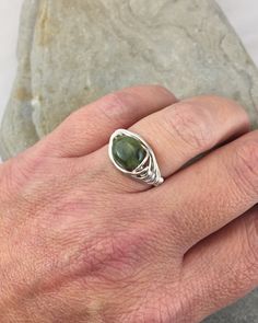 The serene beauty of this green Connemara Marble ring is stunning. made from gorgeous mossy green genuine Connemara Marble. Only found in Ireland, Connemara is one of the worlds rarest marbles and is 600 million years old. Nothing says Ireland more than jewelry made out of this exquisite stone. I chose to enhance this beautiful stone with a Celtic inspired silver wire design to let the natural beauty of the Connemara shine. A perfect gift for any Irish lass. This ring is handmade by me with genu Marble Rings, Celtic Rings, Celtic Jewelry, Solitaire Ring, Silver Wire, Marble, Jewelry Gifts, Silver Rings, Perfect Gift