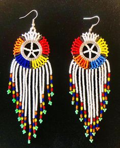 Ethnic Disc with Cascade Earrings | Etsy Multicolor Fair Trade Beaded Earrings, Multicolor Fair Trade Festive Jewelry, Traditional Round Bead Earrings For Festivals, Traditional Multicolor Beaded Earrings For Festive Occasion, Traditional Round Beaded Earrings For Festival, Traditional Multicolor Jewelry With Beaded Fringe, Traditional Multicolor Chandelier Earrings, Traditional Multicolor Earrings For Festival, Multicolor Beaded Drop Earrings For Celebration