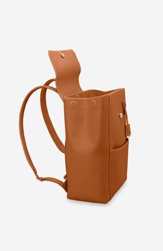 A chic and ultra-spacious office companion to refine your work-from-anywhere style. The Large Soft Backpack, handcrafted entirely from full-grain European leather, reimagines The Mini Soft Backpack with enhanced storage capability and increased all-day comfort. Featuring magnetic closure, a padded laptop sleeve to secure devices up to 16" and priority and zipped pockets to house valuables, the elegant carryall caters to every professional need. Crafted entirely from full grain sustainable DriTan Cognac Leather Travel Backpack With Adjustable Strap, Cognac Leather Backpack With Adjustable Strap For Travel, Versatile Brown Leather Backpack, Modern Backpack With Leather Backing For Work, Brown Travel Backpack With Smooth Grain, Classic Satchel Backpack For Work, Travel Backpack With Smooth Grain In Brown, Leather-backed Backpack For Work, Cognac Leather Backpack Satchel For Everyday