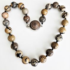 Large round Artistic jasper stones create a gorgeous chunky necklace for you to enjoy!  Each of the unique stones is 16 mm and they are separated with black, high-end crystal bicones.  The bold, 18-inch necklace closes securely with an interlocking clasp that is made from real shell and sterling silver.  One-of-a-kind jewelry like this lovely gemstone necklace makes a great gift for someone special, like you! This necklace is designed and handmade by me, Sharon, of Blonde Peach Jewelry. It will Chunky Stone Necklace, Large Bead Necklace, Peach Jewelry, Stone Necklaces, Trendy Fashion Jewelry, Handmade Jewelry Necklace, Handmade Beaded Necklaces, Stone Beaded Necklace, Jasper Necklace