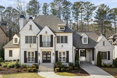 a large white house with black shutters