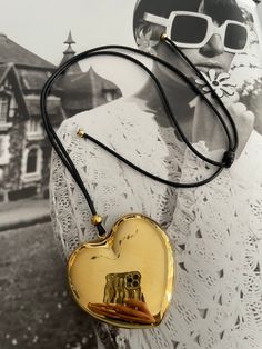 This elegant Golden Heart Necklace features a stunning golden gold heart stainless steel pendant hung on a sleek black leather rope. This timeless accessory is sure to elevate any outfit and make a statement. Crafted with quality materials, this necklace is the perfect addition to any jewelry collection. Golden Heart Necklace, Golden Heart, Timeless Accessories, Stainless Steel Pendant, Gold Heart, Heart Of Gold, The Golden, Heart Necklace, Jewelry Collection