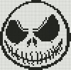 a cross stitch skull with two eyes on it's face, in black and white