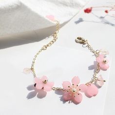 Have you been waiting for those gorgeous sakura blossoms to bloom? The wait is now over with our kawaii pink cherry blossom crystal bracelet! The perfect solution while you wait for mother Nature to get her groove on! Our ready-to-wear link chain bracelet is 15.5cm in length, with the extension chain being 7cm. Available in 3 different options, which of these lovely bracelets will you pick?! Get your kawaii pink cherry blossom crystal bracelet today! Sakura Accessories, Cherry Blossom Bracelet, Kawaii Sakura, Kawaii Bracelet, Blossom Bracelet, Pink Cherry Blossom, Resin Bracelet, New Flower, Pola Gelang