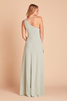 This one-shoulder gown features raised neckline, perfect for bridesmaids who favor a modest look. Available in Sage. 21st-century Grecian goddess. | Sage Bridesmaid Dress Crepe Size Small | Birdy Grey Kira Crepe Bridesmaid Dress, Sage Bridesmaid Dress, White Dresses For Sale, Neutral Dresses, Sage Bridesmaid Dresses, One Shoulder Bridesmaid Dresses, One Shoulder Bridesmaid, Tuxedo Women, Grecian Goddess