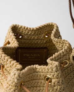 Natural Crochet And Leather Mini-bucket Bag | PRADA Designer Crochet Tote Bag For Travel, Luxury Leather Crochet Bag, Designer Travel Straw Bag With Handles, Designer Woven Leather Bucket Straw Bag, Designer Woven Leather Straw Bucket Bag, Luxury Leather Crochet Bag With Leather Handles, Luxury Crochet Leather Bag With Leather Handles, Designer Beige Crochet Tote Bag, Beige Bucket Bag With Intrecciato Weave