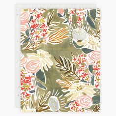 a notebook with flowers and leaves on it