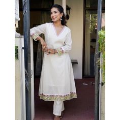 White pure cotton kurta set with hand embroidery details. Size Chart THESE ARE GARMENT MEASUREMENTS (IN INCHES)  XSSMLXLXXL Chest343638404244 Waist303335373941 Hip363840424446 Shoulder13.51414.51515.515.5 Kurta Length484848484848 Pants Length393939393939 Embrace your mesmerizing look with this crafted White Embroidered Cotton Anarkali Kurta with Pants Set. The White Cotton Anarkali kurta has embroidery, a round neckline and 3/4th sleeves. The White cotton pants have embroidery and both of them have an attached lining. COLOUR: White MATERIALS: Cotton CARE: Dry Clean Only We accept PayPal for payment, a safest way for both of us.  Thank you! Cotton Straight Kurta With Embroidered Border, Cotton Kurta With Embroidered Hem For Eid, Eid Cotton Kurta With Embroidered Hem, Festive Traditional Kurta With Embroidered Hem, Traditional Sets With Embroidered Hem For Eid, Festive Eid Kurta With Embroidered Hem, Traditional Festive Sets With Embroidered Hem, Traditional Eid Sets With Embroidered Hem, Festive Straight Kurta With Embroidered Hem