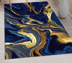 a blue and gold area rug in a living room