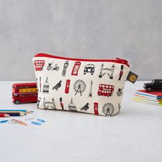 This hand illustrated Cosmetic Bag / Pencil Case features all your favorite London icons and is perfect for travel. Bring a bit of London with you wherever you go! Handmade in Britain. 100% Panama cotton with waterproof lining. London Icons, The London Eye, Sustainable Supply Chain, London Landmarks, London Bus, Post Box, Pencil Boxes, London Eye, Pencil Pouch