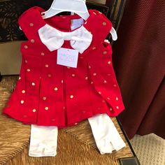 Little Baby Girl Dress By Maggie & Zoe. Size For 6-9 Months. Shell: 70% Cotton & 30% Polyester Lining: 57% Cotton 38% Polyester And 5% Spandex. Trim 100% Polyester. Color. Beautiful Red And Gold And White Leggings. Box15 Red Spring Holiday Sets, Playful Fitted Set For Dress-up, Cute Cotton Sets For Holidays, Cute Cotton Holiday Sets, Playful Fitted Dress-up Sets, Cute Fitted Christmas Sets, Cotton Sets For Playtime During Holidays, Cotton Playtime Sets For Holiday, Red First Birthday Dress For Spring