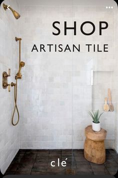 a white tiled bathroom with the words shop artisan tile written on the wall next to it