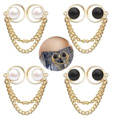 four pairs of black and white earrings with chains on each side, one has an eyeball