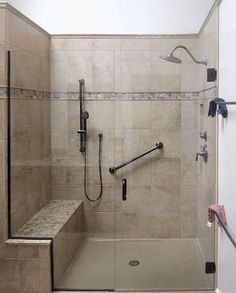 a walk in shower sitting inside of a bathroom