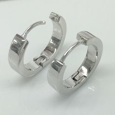 18 gauge sterling silver hoop earrings for men. Handmade from solid high quality 925 sterling silver and plated in yellow gold. Sold as a pair or single earring. Specification Base metal: 925 sterling silver Outer plating: white gold, polished Outer diameter: 17mm Inner diameter: 13mm, size L Width: 3.5mm Measurements are an approximation Ear post gauge: 18G Link to customize ear post gauge https://www.etsy.com/listing/245008458 More gauged earrings https://www.etsy.com/shop/360JewelsElite?ref=h Handmade Silver Small Hoop Plug Earrings, Silver Hoop Plug Earrings, Mens Earrings Hoop Silver, Nickel-free Hoop Metal Plug Earrings, Nickel-free Small Hoop Silver Plug Earrings, Hoop Earrings For Men, Gauge Earrings, Mens Earrings Hoop, Earrings For Men