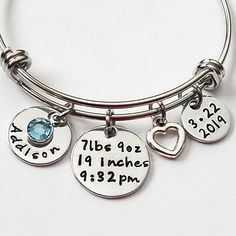 Free Shipping on orders $35 and over. Item Features: 1 - Stainless Steel Adjustable Bangle 1 - Date Charm 1 - Personalized name charm (you choose the name) 1 - Birthstone crystal (you choose the month) 1 - Birth Stats Charm 1 - Silver heart charm Bracelet will come packaged in a pretty organza pouch ready for gift giving. We cannot stamp on the backs of any of our hand stamped items.  To see more Bracelets for Mom click the link below: https://www.etsy.com/listing/598641237/baby-name-bracelet-mom-bracelet-birthday?ref=shop_home_active_10&frs=1 https://www.etsy.com/listing/222557249/baby-name-bracelet-new-mom-gift-new-baby?ga_search_query=your%2Bfirst%2Bbreath&ref=shop_items_search_1&frs=1 https://www.etsy.com/listing/399828117/new-mom-gift-push-gift-personalized?ga_search_query=your%2Bfirs Hypoallergenic Charm Bracelet For Birthday, Adjustable Charm Bracelet For Birthdays, Adjustable Round Charm Bracelet For Birthday, Adjustable Charm Bracelets For Birthday, Adjustable Hypoallergenic Charm Bracelet For Birthday, Adjustable Name Bracelet With Charms For Birthday, Adjustable Charm Bracelet For Birthday And Mother's Day, Nickel-free Charm Bracelet For Birthday And Mother's Day, Adjustable Hypoallergenic Charm Bracelet For Birthdays