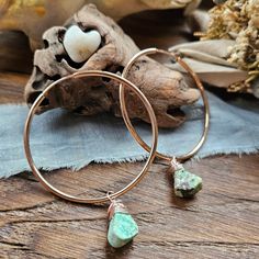 "Rose Gold Plated over 92.5% Sterling Silver Hoop Earrings. Genuine Turquoise Gemstone Crystals. The most comfortable hoop earrings you will ever wear. I love this closure method. It's like there's nothing there! And not only are they comfortable but they are lightweight.  Two sizes available: Medium hoops measuring approximately 2.75\" in length and 2.0\" wide. Large hoops measuring approximately 3.25\" in length and 2.25\" wide. Photograph with model is wearing the medium size.  Photograph with three pairs is to illustrate variations in turquoise cut and color. Lead free and hypoallergenic. All jewelry comes gift wrapped in a kraft brown jewelry box with complimentary lavender sachet and business card." Green Bohemian Hoop Earrings Hypoallergenic, Bohemian Green Hoop Earrings Hypoallergenic, Bohemian Green Hypoallergenic Hoop Earrings, Bohemian Hypoallergenic Hoop Jewelry, Brown Jewelry, Lavender Sachets, Bohemian Hippie, Sterling Silver Hoop Earrings, Genuine Turquoise