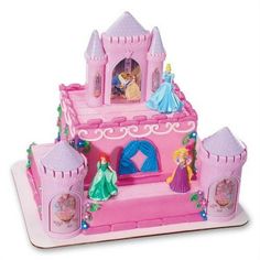 a pink castle with princess figures on it