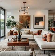 a living room filled with furniture and lots of windows