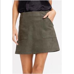 - Textured Stretch A Line Mini Skirt - Faux Suede Textured Stretch Polyester- A-Line - Pockets - Zipper On Center Back - Model Is 5' 8" 33-24-34 And Wearing A Size Small. Color: Olive Materials: 95% Polyester 5% Spandex Bin17 Fall Green Mini Skirt For Work, A-line Skort For Workwear In Fall, Green Lined Mini Skirt For Fall, Fall Green Lined Mini Skirt, Fall Flared Mini Skirt With Pockets, Chic Green Skort For Fall, Chic Flared Skort With Pockets, Chic Skort With Pockets And Flared Skirt, Fall Workwear A-line Skort