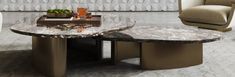 a marble table with two chairs in the background