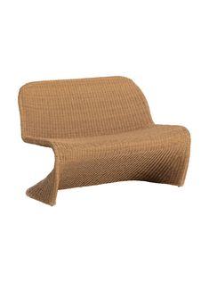 an upholstered chair that is made out of knitted fabric and has a curved back