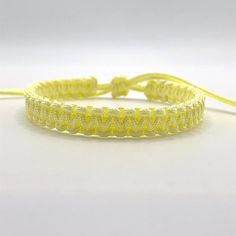 This bracelet is make with  Chinese Knotting Cord about 1.5mm thin cord.   The Bracelet is adjustable in size,  6 inches closed to 12 1/2 inches.  Color: Light Yellow Feel free to contact me for any question!! *Color may slightly different due to the lighting!! ** This is HANDMADE item, the color of pattern, shape might be little different Chinese Knotting Cord, Chinese Knotting, Braid Bracelet, Surfer Bracelets, Lucky Bracelet, Bracelet Simple, Chinese Knot, Yoga Bracelet, Cord Bracelet