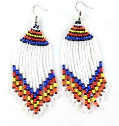 These African bead earrings are handmade by our Massai artisans in Kenya, East Africa. The beads are put on a string one by one and rolled around a wire. The entire process is done by hand. Authentic and Unique. Fair Trade Product. 100% handmade with love. Handmade in Kenya, East Africa Ethically & sustainably handcrafted Measures Approximately 2" in diameter Artisans make 2-3 times what they would earn in their local market. Each pair of earrings is made by hand so there may be slight and s Artisan Adjustable Beaded Earrings With Tiny Beads, White Bohemian Jewelry With Large Beads, Unique White Beaded Jewelry, Adjustable Artisan Beads With Dangling Details, Artisan Adjustable Beaded Dangle Earrings, Artisan Beaded Dangle Earrings, Artisan Adjustable Dangle Beaded Earrings, Artisan Dangle Beaded Earrings, Unique Adjustable Beaded Earrings With Dangling Beads