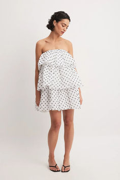 Chiffon Layered Strapless Mini Dress Summer Strapless Chiffon Dress With Ruffles, Casual Mini Length Strapless Dress, Chic Chiffon Ruffle Mini Dress, Flowy Strapless Mini Dress With Ruffles, Strapless Flowy Mini Dress With Ruffles, Flowy Strapless Mini Dress, Chic Chiffon Mini Dress With Ruffled Skirt, Polka Dot Mini Dress For The Beach, White Tiered Chiffon Mini Dress