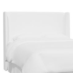 a bed with white sheets and pillows on it's headboard, against a white background