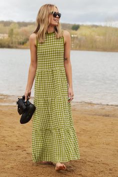 Get ready to turn heads with the Paula Gingham Knitted Midi Dress! Made with vegan-friendly yarns, this sleeveless dress is both comfortable and stylish. The vibrant green gingham pattern adds a playful twist to your look, perfect for Spring and Summer occasions. With its flattering midi length silhouette, you'll make a statement with every step. British made and perfect for any occasion - from brunch to garden parties. This dress is 100% knitted in a lightweight cotton blend yarn 50% Recycled C Casual Sleeveless Dress For Spring Picnic, Plaid Sleeveless Dress For Picnic, Sleeveless Plaid Dress For Picnic, Green Casual Dress For Picnic, Casual Green Dress For Picnic, Green Midi Dress For Picnic, Sleeveless Plaid Dress For Spring, Green Summer Dress For Picnic, Casual Plaid Midi Dress For Picnic