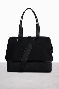 Our black weekender bag is the ultimate travel companion. Easy packing, a separate shoe compartment + adjustable shoulder strap. Shop today! Weekend Duffle Bag, Wet Dry Bag, Perfect Travel Bag, Shopping Totes, Dog Clip, Black Travel, Dry Bag, Wire Frame, Work Bag