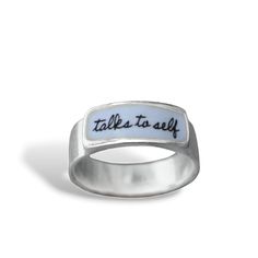 Is it time to admit that you talk to yourself? Come out in style. Each ring is cast in sterling silver, to which 3 layers of vitreous enamel are applied and fired at 1400 degrees making a durable, waterproof and vibrant ring. Band width goes from 1/8" up to 1/4" depending on the size.  Available in whole sizes 5-12. I ship First Class Mail in a gift box. To see my entire store go here:  https://www.etsy.com/shop/marmar To see my gemstone and modern store go here: https://www.etsy.com/shop/marmar Inspirational Silver Promise Ring, Silver Enamel Promise Ring, Silver Sterling Silver Enamel Promise Ring, Meaningful Sterling Silver Rings With Engraving Option, Silver Stackable Enamel Ring As Gift, Silver Stackable Enamel Ring Gift, Talk To Yourself, Glass Store, Modern Store