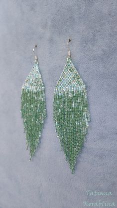 These handmade author's bright sparkling iridescent earrings are made of high-quality Japanese microscopic beads Delica. These earrings look very elegant and weightless. Color:mint . 100% hand made with love! Measurements: Length with hook - about 11.5 cm( 4,52 inch ),Width -3 cm (1,18 inch) Materials: Silver plated ear hooks Japanese microscopic beads Delica Tytan Threadbeige Green Chandelier Earrings For Party, Elegant Green Beaded Crystal Earrings, Green Beaded Earrings With Dangling Beads For Wedding, Green Teardrop Beaded Earrings For Party, Handmade Green Chandelier Earrings For Party, Green Beaded Chandelier Earrings For Wedding, Handmade Green Earrings For Party, Handmade Green Crystal Earrings With Round Beads, Handmade Chandelier Earrings With Round Beads For Party