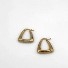 Elegant hallowed out gold triangle shaped hoop earrings Gold Triangle Metal Earrings, Triangle Gold Metal Earrings, Modern Triangle Gold Hoop Earrings, Trendy Gold Triangle Earrings, Gold Triangle Minimalist Earrings, Minimalist Gold Triangle Earrings, Minimalist Triangle Hoop Earrings As Gift, Everyday Gold Triangle Earrings, Trendy Triangle Earrings