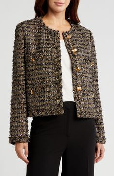 French eyelash tweed lit with metallic shimmer brings rich texture and depth to this collarless jacket tailored in a cropped silhouette finished with jewelry-inspired buttons. Front button closure Jewel neck Front patch pockets Lined 37% nylon, 20% acrylic, 13% viscose, 11% cotton, 11% metallic fibers, 8% wool Dry clean Imported Designer Clothing Tweed Boucle Jacket, Collarless Jacket, Boucle Jacket, Black Tweed, Jewel Neck, Tweed Jacket, St John, Clothing Items, Size 16