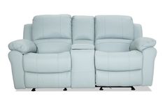 the reclining loveseat has two pillows on it's arms and is light blue