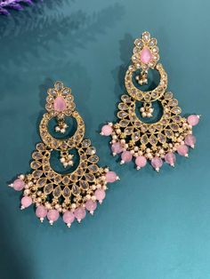 High quality polki earring. About 2 inch long and 2inch wide. Kundan Chandelier Earrings For Party, Party Kundan Chandelier Earrings For Pierced Ears, Party Kundan Chandelier Earrings, Party Chandelier Earrings In Kundan, Metal Chandbali Bridal Earrings, Bollywood Style Bridal Dangle Earrings In Metal, Bollywood Style Bridal Dangle Earrings, Festive Hand Set Metal Earrings, Bollywood Style Drop Danglers For Pierced Ears