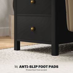 an image of a black nightstand with gold knobs on the top and bottom drawers