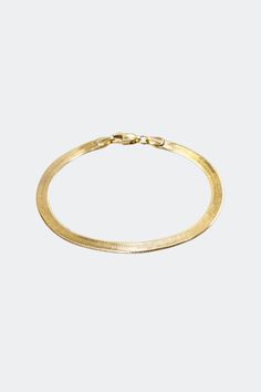 A sleek and versatile piece in the Hydez Essential Collection, the Leia 18K Gold vermeil herringbone chain bracelet smooth and reflective design drapes on your wrist like liquid gold. The perfect balance of elegance and simplicity, the Leia bracelet effortlessly transitions from day to night. Material: 18K Gold Vermeil Dimensions: 7 inch length, 4.5mm width What is 18K Gold Vermeil?: 3 microns of 18K Gold over Sterling Silver. Vermeil is far more durable to wear than traditional gold-plating due Herringbone Chain, Liquid Gold, Day To Night, To Night, Gold Plating, Gold Vermeil, Chain Bracelet, Herringbone, Gold Bracelet