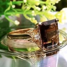 4.88 Carat Natural Brown Topaz & Diamonds 14k Solid Gold Ring Ring Material: 14k Solid Gold  Total Metal Weight: 3.8 Grams  Gemstone: Natural Smoky Topaz Gemstone Color: Brown Gemstone Shape: Emerald Gemstone Dimensions: 11.00x9.00 mm Gemstone Quantity: 1 Gemstone Carat Weight: 4.80 Carat Diamonds: Natural Round Shaped  Diamonds Quantity: 2 Diamonds Total Carat Weight: 0.08 Carat Total Carat Weight: 4.88 Carat Ring Quantity: One Ring Condition: New Made in the USA Delivered in an elegant gift box 💜Please do not hesitate to ask any questions and we will be happy to assist You 💜 Elegant 14k Gold Topaz Ring With Vs Clarity, Rectangular 14k Gold Jewelry With Accent Stones, Heirloom 14k Gold Diamond Ring With Accent Stones, Classic 14k Gold Brown Ring, Classic Brown Diamond Jewelry, Fine Jewelry In 14k Gold With Brown Color, Fine Jewelry In 14k Gold, Brown, Brown 14k Gold Fine Jewelry Ring, Brown 14k Gold Rings Fine Jewelry